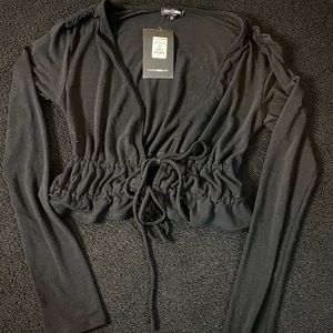 Black long sleeve front tie crop top, size medium